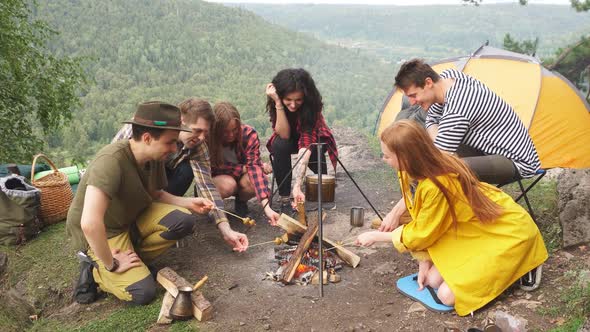 Young Hikers Spending Time in the Camp, Preparing Food, Weekend with Friends alt
