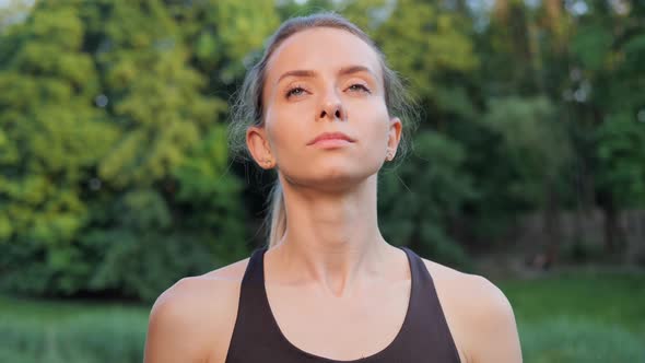 Girl Feeling Relieve and Happy After Fresh Morning Exercise in the City Park alt