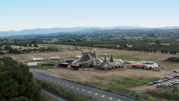 Yellow and Black Circus Tent in the Countryside Aerial View alt