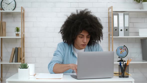 Student Guy Using Laptop Reading Positive Message Studying Online Indoors alt