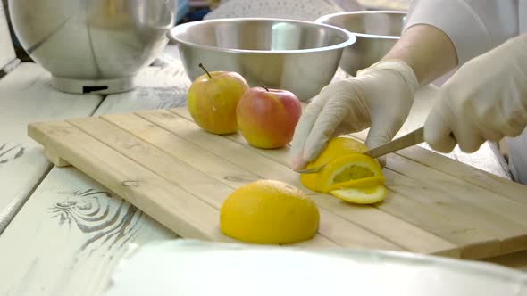 Chef in Gloves Cutting Fruits alt