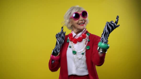 Funny grandmother in studio alt