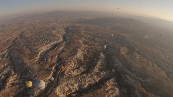 Cappadocia Aerial Shot of Rock Chimneys and Uchisar Castle in Goreme Turkey alt