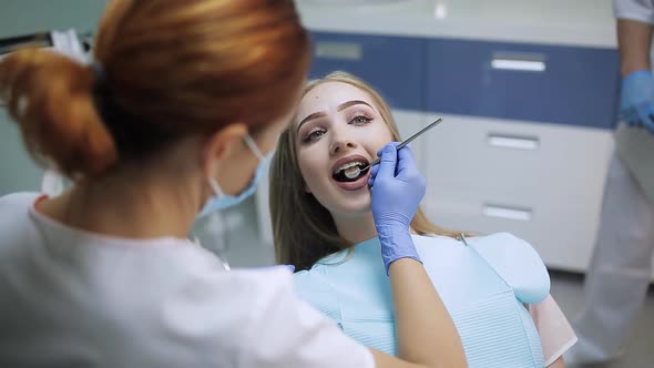 Female Stomatologist in Mask alt