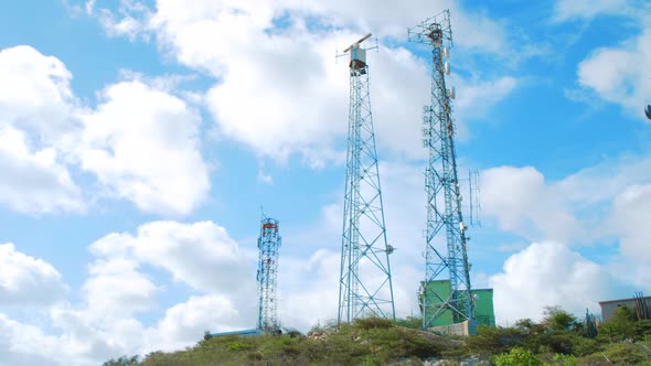 Coastal surveillance radar antenna and cell site tower, Low Angle Wide Shot alt