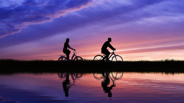 Silhouette Of Cycling On Sunset Background