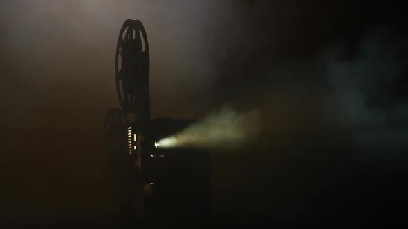Shows Movie in a Projector in the Smoke. Black Background alt