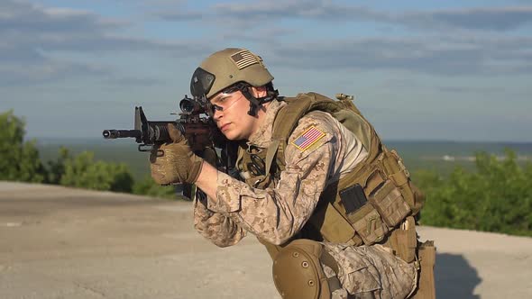 Armed Man Taking Aim. Airsoft. alt