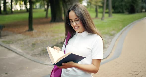 Female Student Reading Book