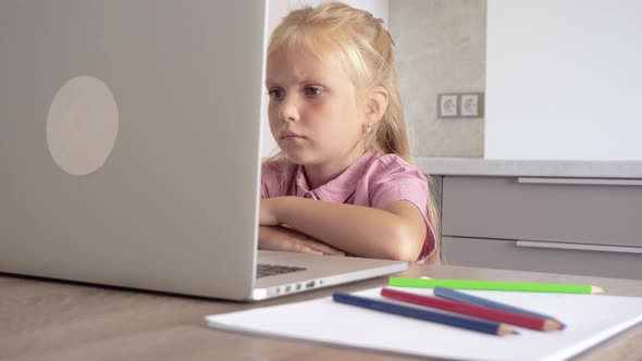 Little girl at the computer