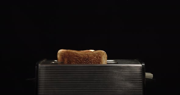 Toast popping up in a toaster