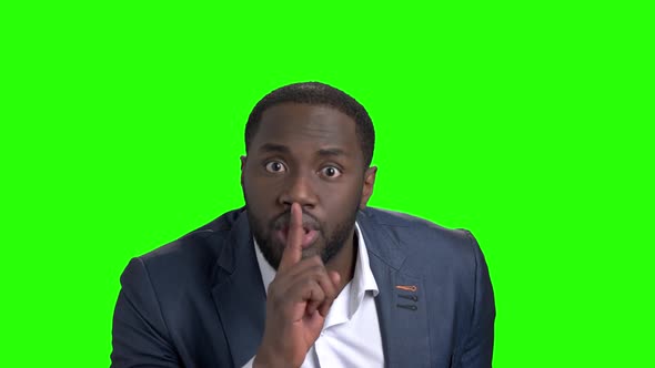 Afro-american Businessman Showing Silence Gesture. alt