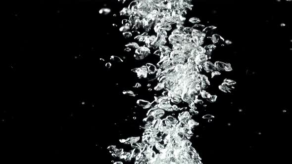 A Jet of Air Bubbles Under Water Rises Upwards alt