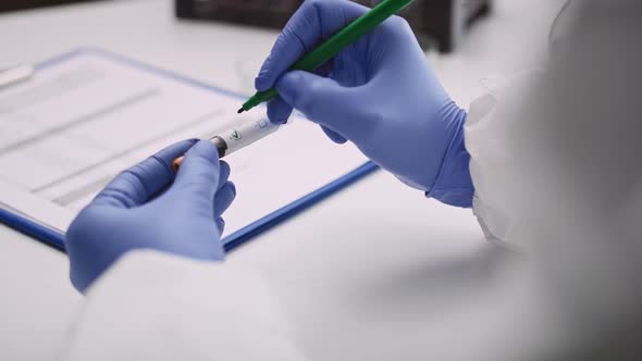 Video of positive medical coronavirus test. Shot with RED helium camera  alt