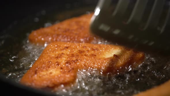 Fried Cheese Gets Flipped on the Other Side on a Pan with Sizzling Oil  Closeup alt