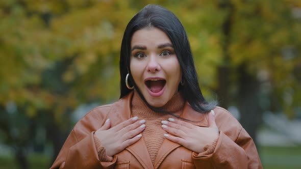 Portrait Astonished Hispanic Happy Girl Receives Unexpected Surprise in Park Outdoors Young alt