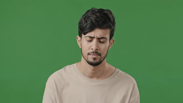 Arabian Man Upset Disappointed Young Hispanic Guy Boyfriend in Desperate Standing on Green alt