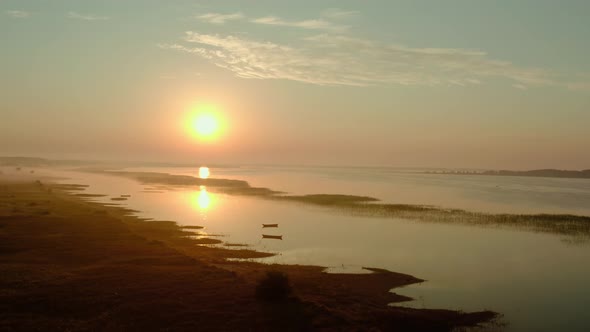 Aerial Drone View, Drone Flies Forward Slowly Towards, Boat on the Sunrise, Morning Fishing on a alt