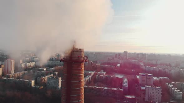 Air Pollution Problem - a Big Industrial Pipe Pollutes the Air in the City alt