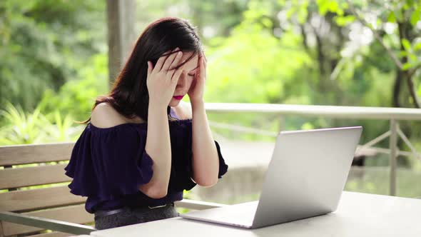 stressed woman using laptop computer