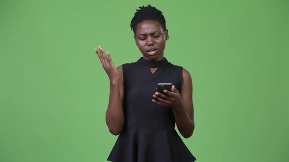 Young Beautiful African Businesswoman Using Phone