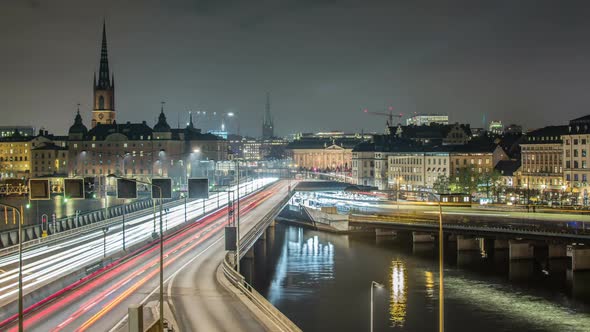 Stockholm city time lapse. Night traffic bridge