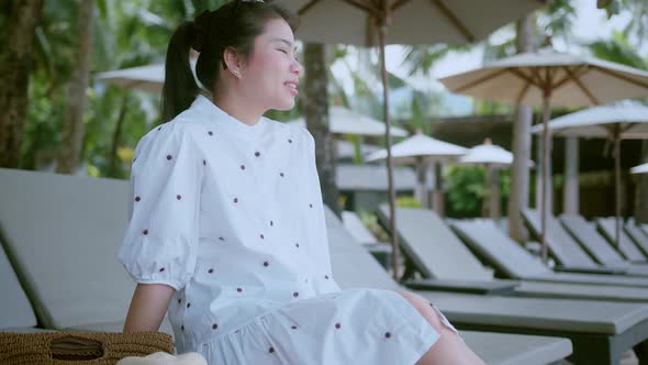 asian female traveller wear casual cloth dress enjoy vacation sunset moment hand