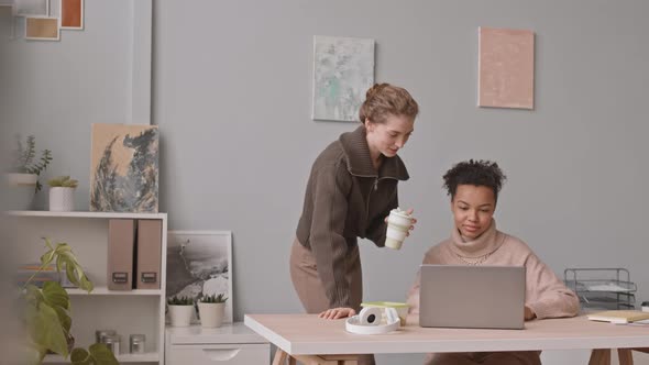 Female Colleagues Working on Project Together alt