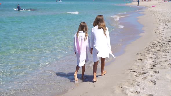 Adorable Little Girls at Beach During Summer Vacation