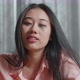 Close Up Of Drunk Asian Woman Drinking Vodka And Looking At Camera At Home - VideoHive Item for Sale