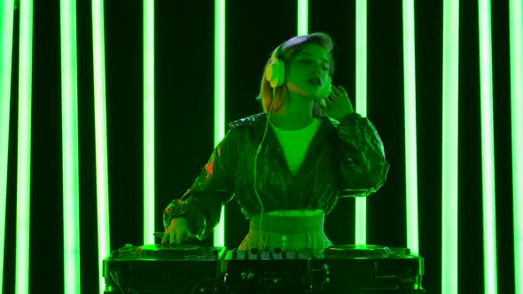 Portrait Young Stylish Woman Big White Headphones Dances Mixes Music DJ Turntable alt