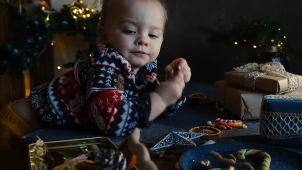 Playful Kid Decorating Christmas Presents alt