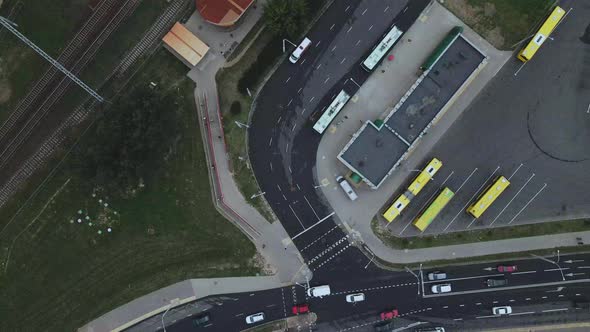 Railway station in the suburbs. A train passes through the station. alt