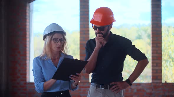 Two Architects Working On Building Model Blueprints. Civil Engineer Architectural Project. alt