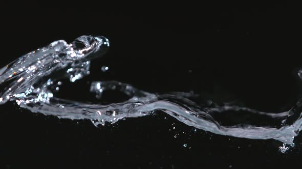 Super Slowmotion Shot of Water Wave Against Black alt