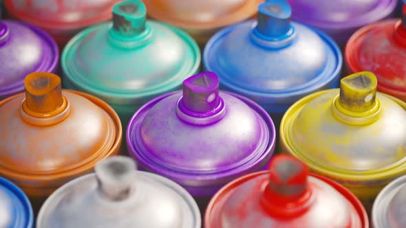 Multiple spray paint cans stacked in a pattern. Infinite looping animation. 4KHD alt