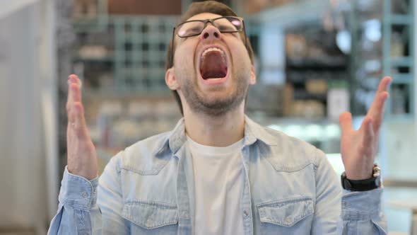 Young Man Shouting Screaming alt