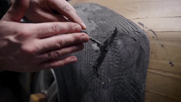 Master Is Working with Modeling Clay for Creating Details for Tuning Car Body in Auto Service alt