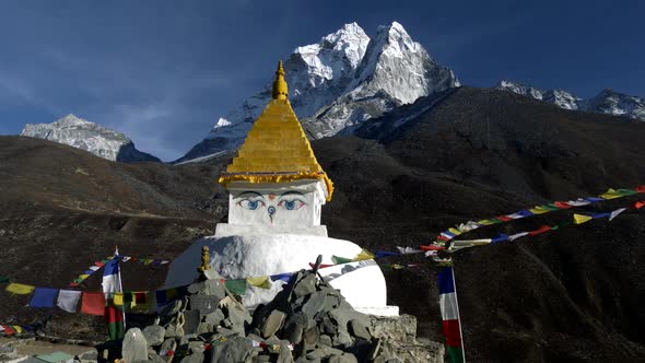 Buddhist Stupa on Mountain Trekking Path in Himalayas, Nepal. Crane Shot. , FHD alt