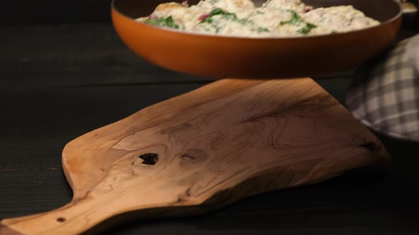 Delicious Small Meatballs with Spinach in a Creamy Sauce in the Frying Pan alt