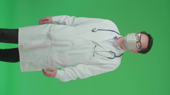 Asian Doctor With Stethoscope Wearing Mask, Walking On Green Screen Chroma Key alt