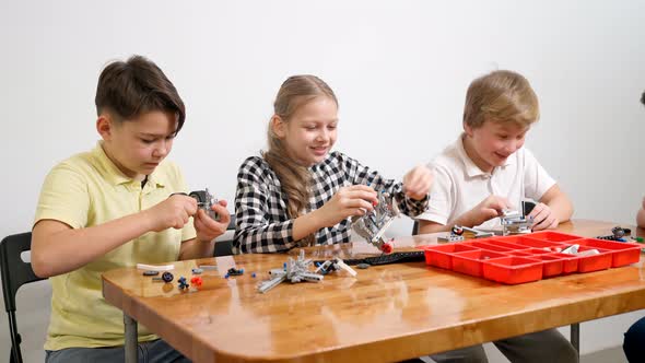 Young Friends Giving Five Using Building Kit alt