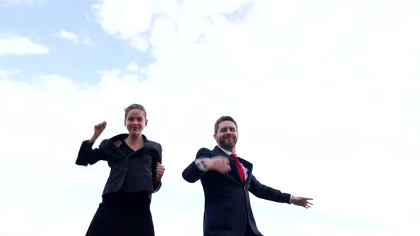 Successful Business Couple of Happy Man and Woman Dance in Sky Success