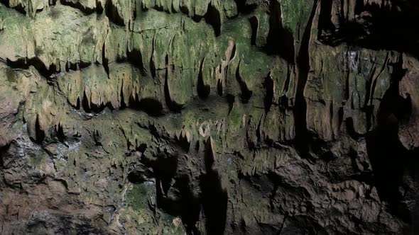 Underground cavern decoration slow tilt 3840X2160 UltraHD  footage - Old cave formations of stalacti