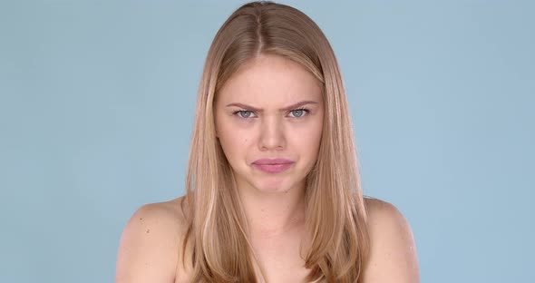 Angry Young Female, Blond Hair with Bare Shoulders alt