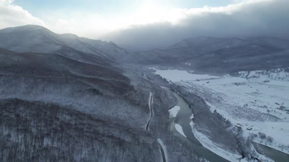 Aerial View of Plateau LagoNaki Mountain Twisted Road in the Winter and Driving Car alt