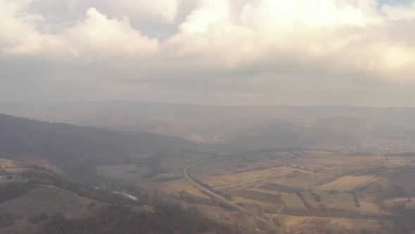 Polluted air over the valley 4K aerial footage alt