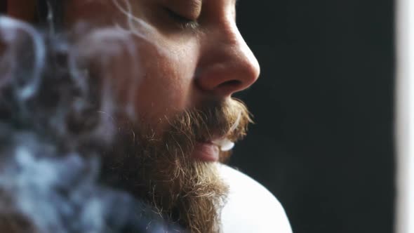 Man Holding a Cigar alt