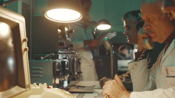 Vintage sci-fi scientists working in a operation room