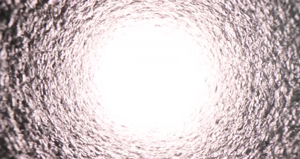 Texture of Rough Pipe Inside and Bright Light at End of Tunnel alt